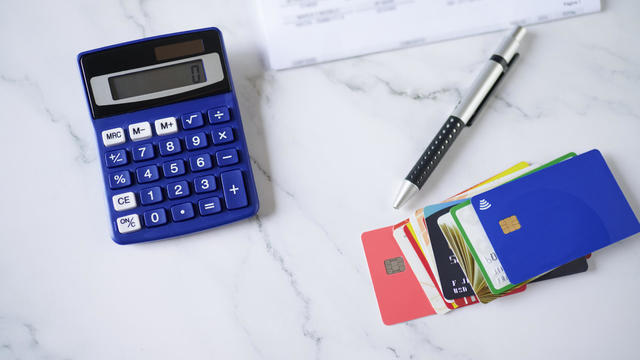 Credit cards with calculator and bill 